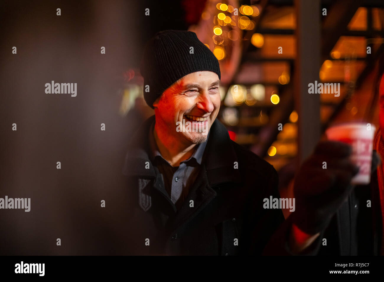 Portrait of man laughing at Christmas market, Zagreb, Croatia. Stock Photo