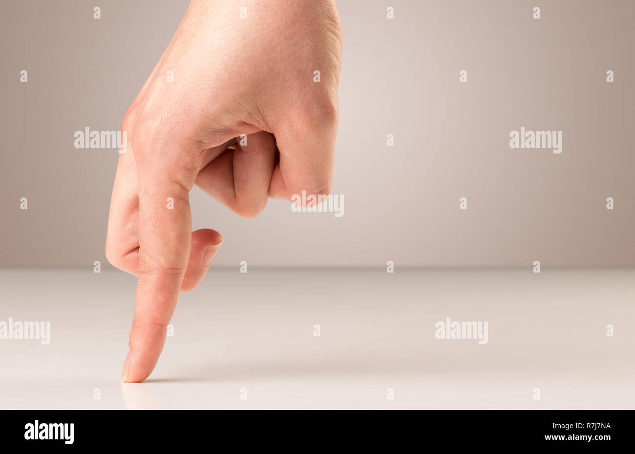 Female fingers walking on white surface Stock Photo Alamy