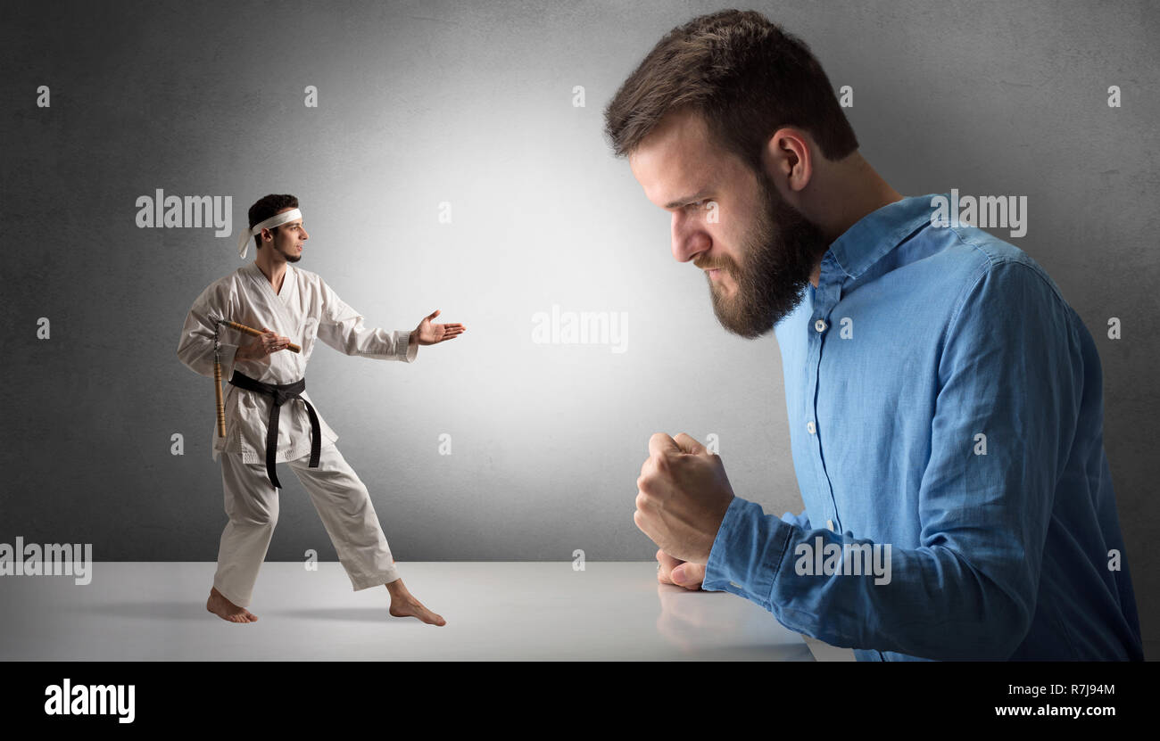 Giant hipster man yelling at a small karate man Stock Photo Alamy