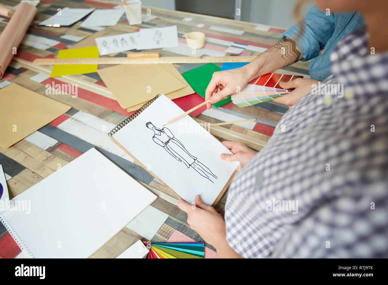 Discussing design of dress Stock Photo Alamy