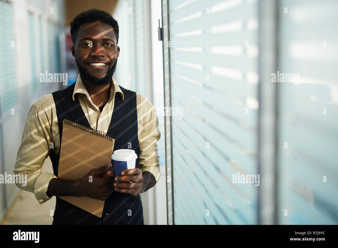 Smiling black designer with sketchpad Stock Photo