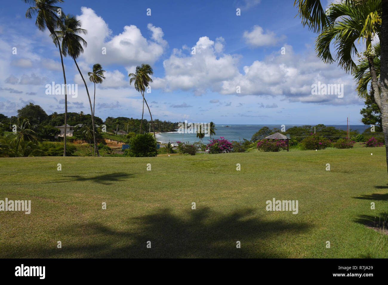Poster like picturesque composition of well established holiday beach resort of northern Tobago within beautiful hilly surroundings and facilities. Stock Photo