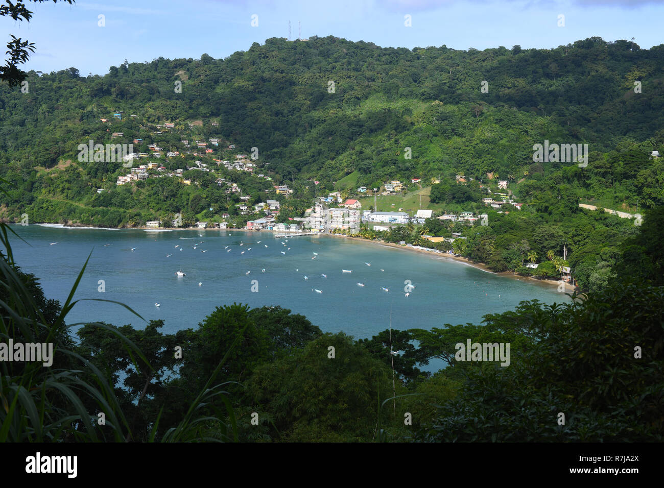 Poster like picturesque composition of well established holiday beach resort of northern Tobago within beautiful hilly surroundings and facilities. Stock Photo