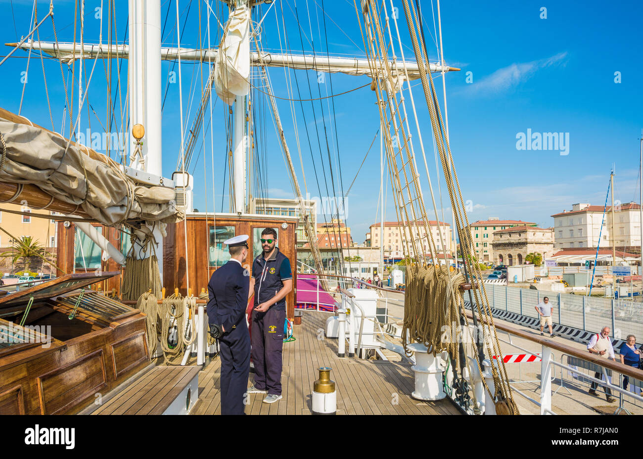 the Nave Italia ship of the Italian navy with ropes and equipment on the bridge on the port of Livorno. Nave Italia is the biggest sailing brig in the Stock Photo