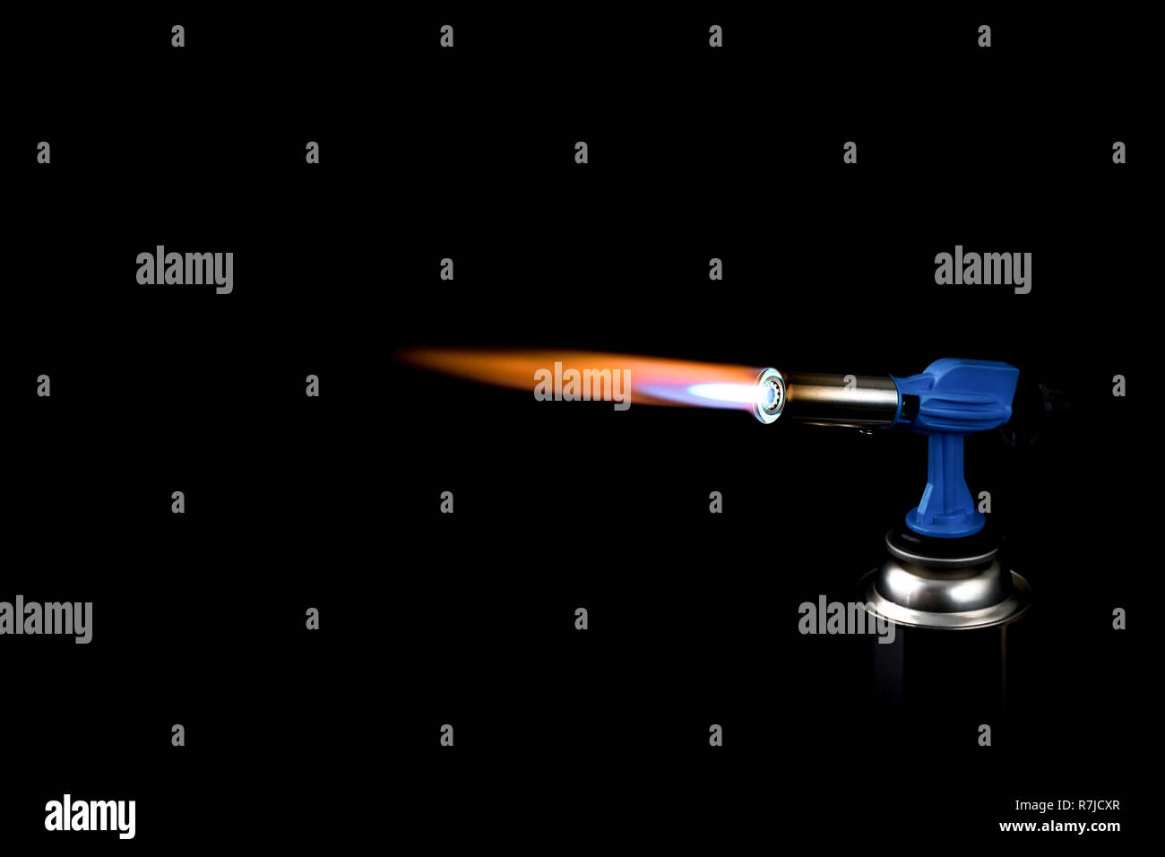 flame from a household gas burner with a ballon on a black background Stock Photo