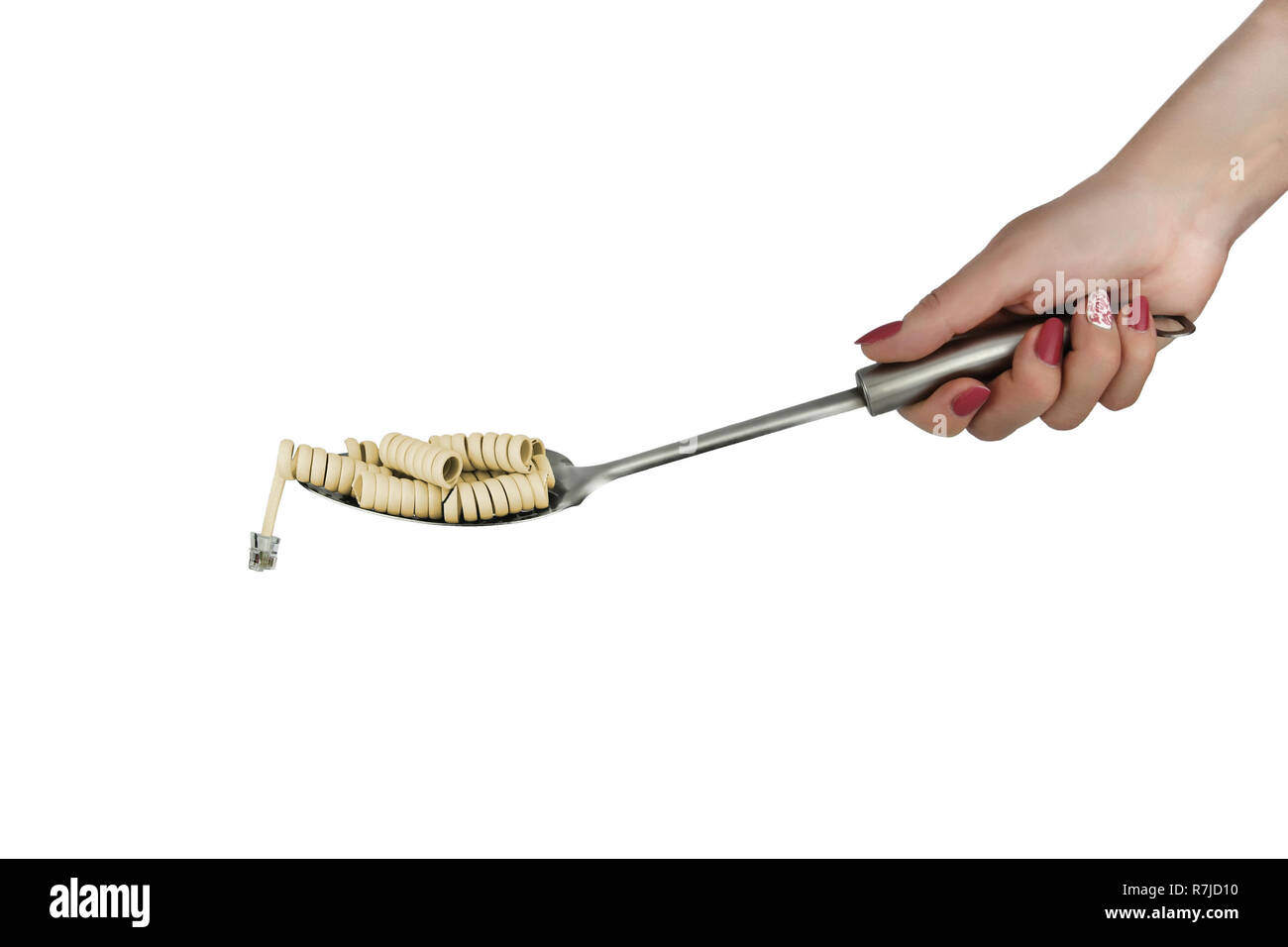 twisted the phone cord as pasta on a spoon Stock Photo