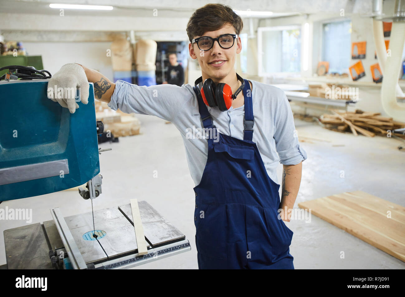Confident carpentry specialist in workshop Stock Photo