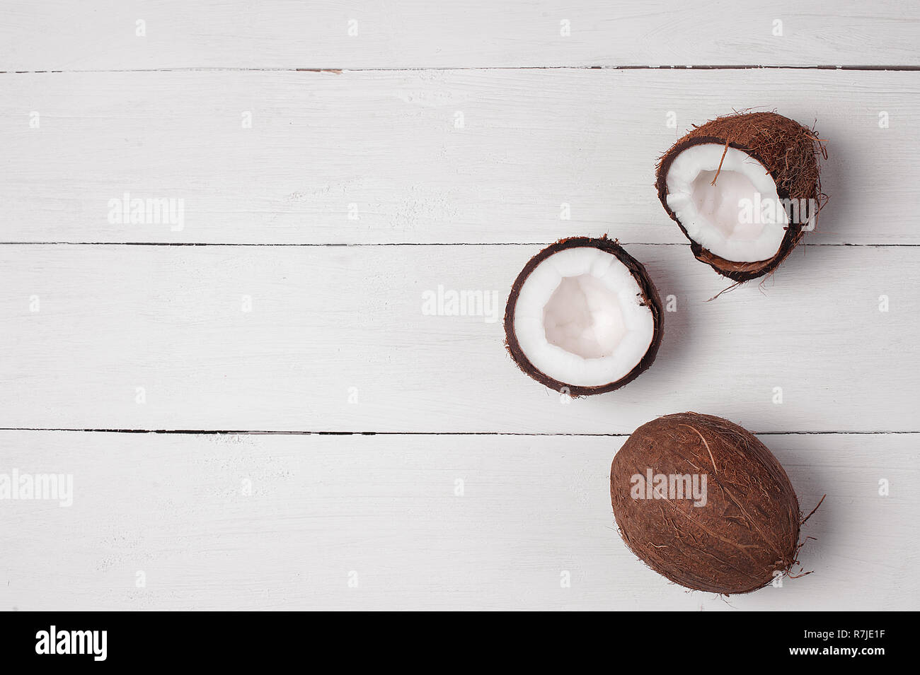 Coconuts on a white wooden background. Exotic fruit Stock Photo