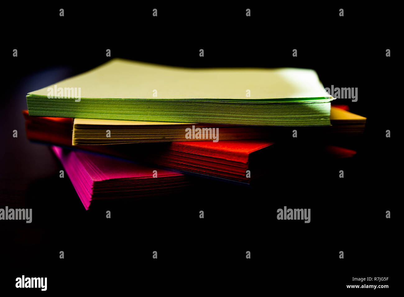 Four kinds of coloured sticky notes in formation Stock Photo
