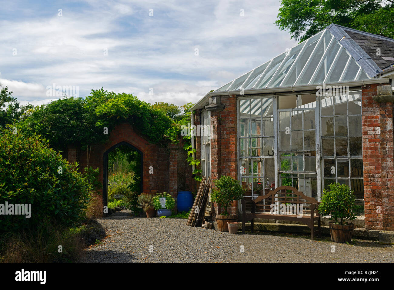 Walled garden,rustic red brick wall,conservatory,glass house,path,pathway,beaulieu house and gardens,drogheda,louth,RM Floral Stock Photo