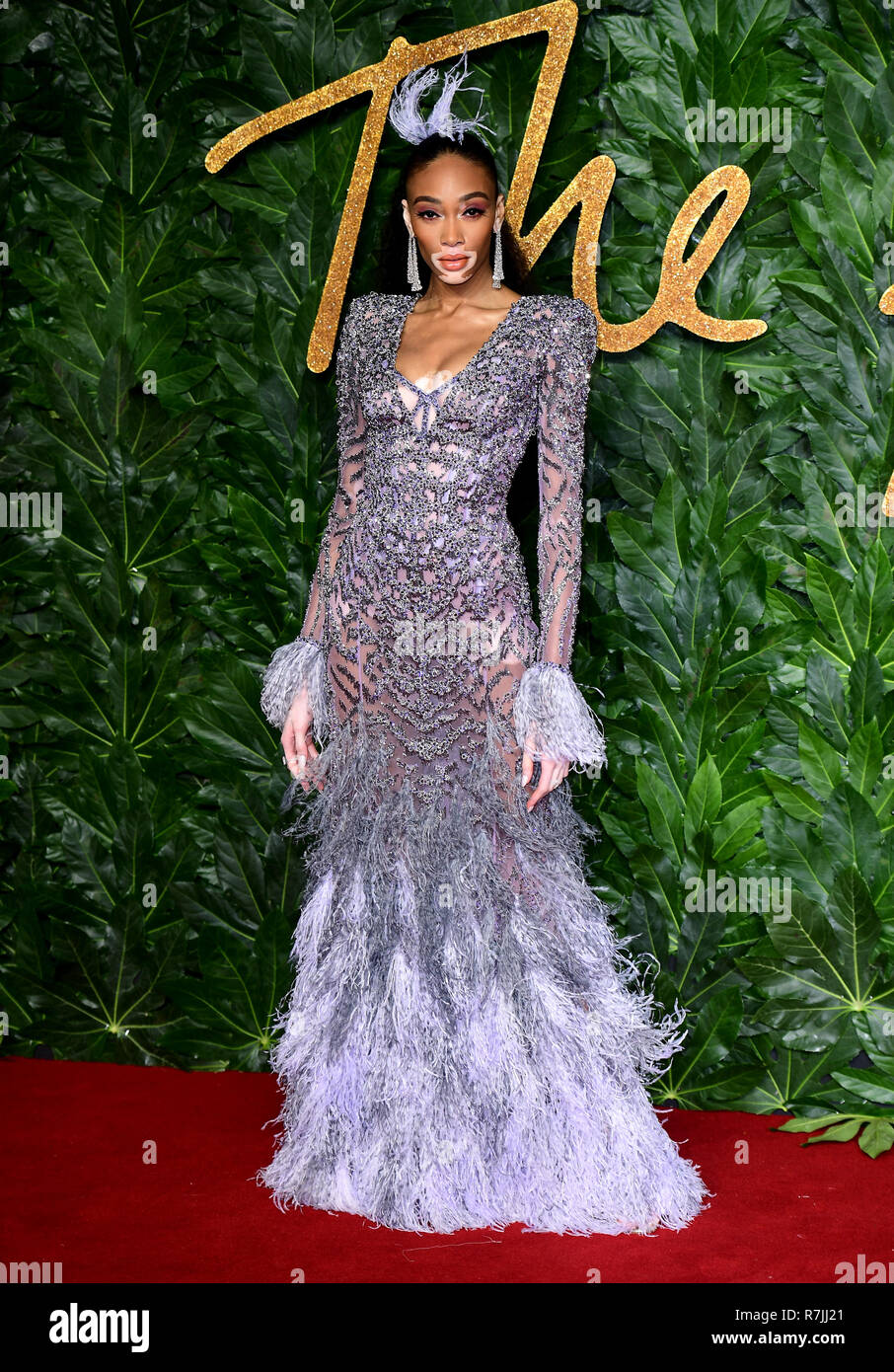 winnie harlow green dress attending the Fashion Awards in association with Swarovski held at the Royal Albert Hall, Kensington Gore, London Stock Photo collection:fitted-homecoming-dresses