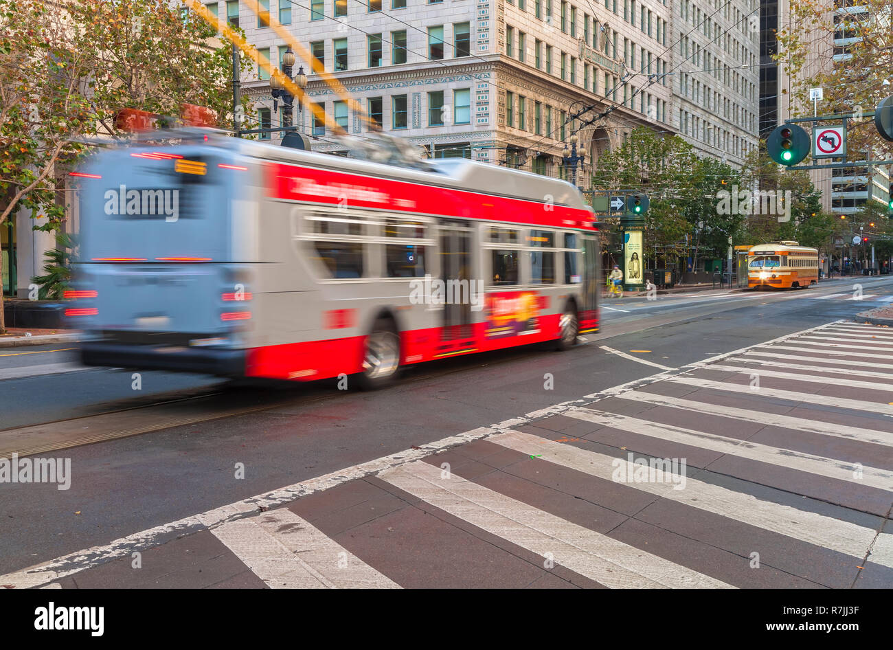 Trolley buses in motion on the Market Street in San Francisco