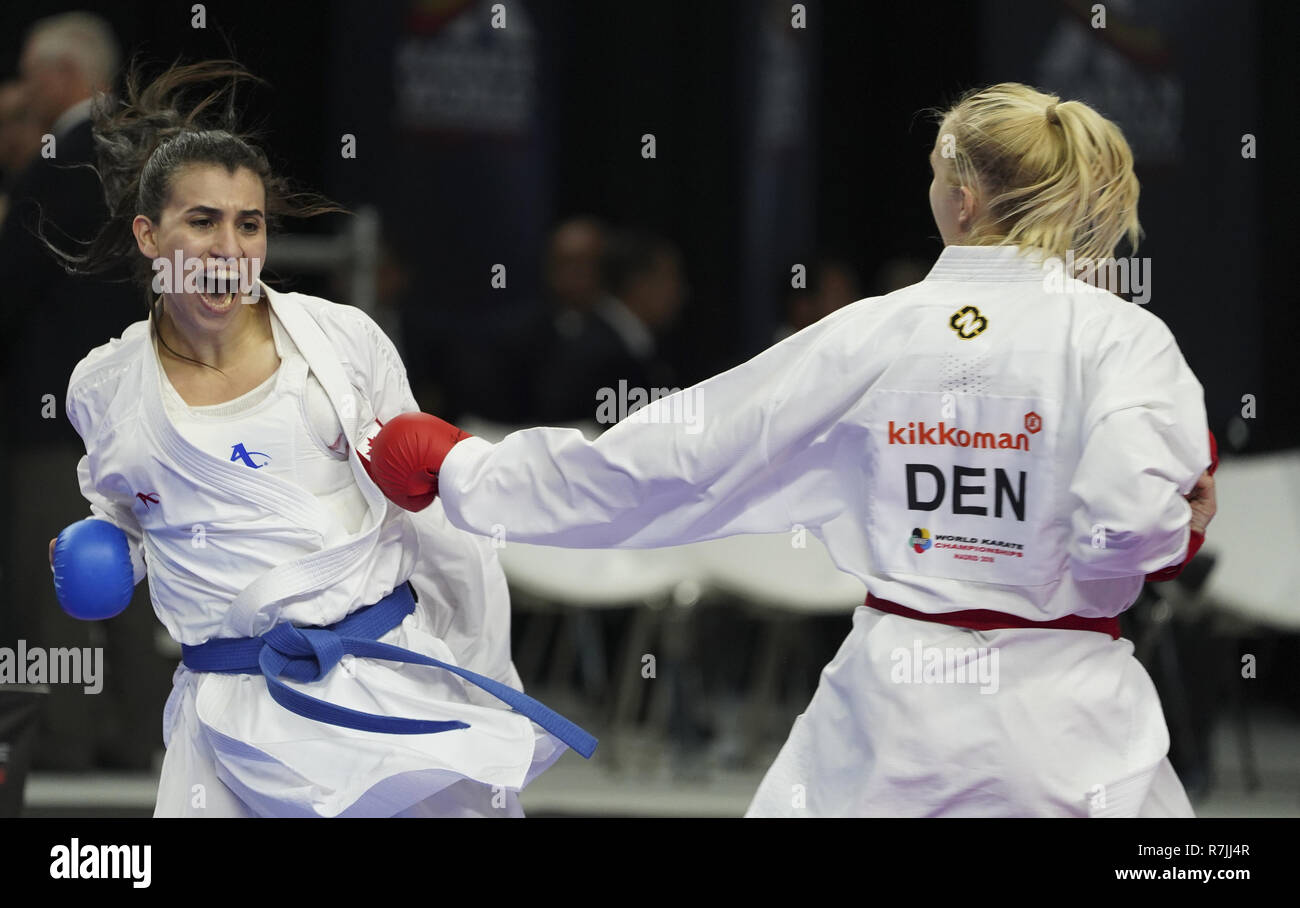 Women karate contestants compete in the elimination round of Kumite by