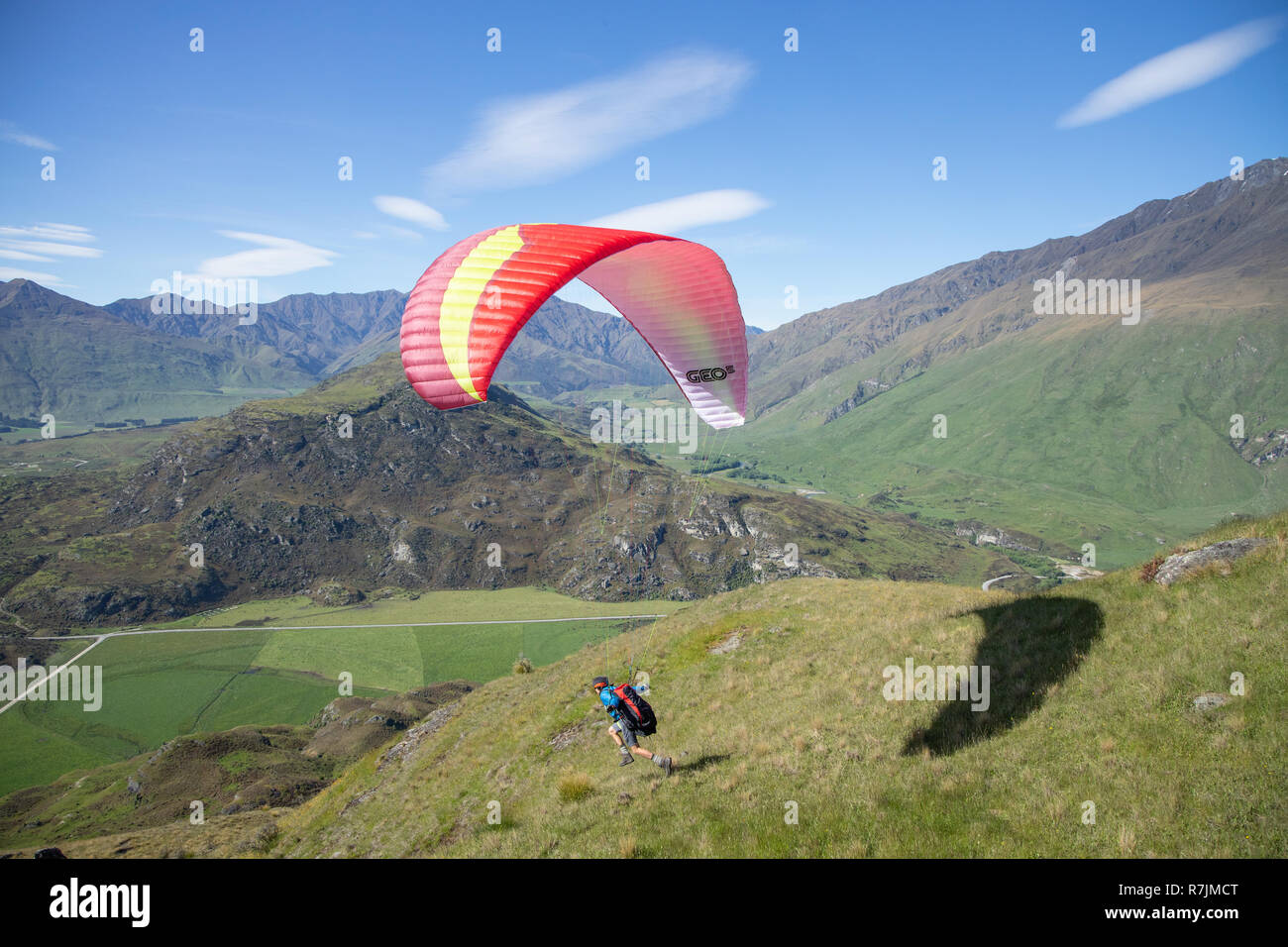 Solo Paraglider above Lake Wanaka, New Zealand Stock Photo