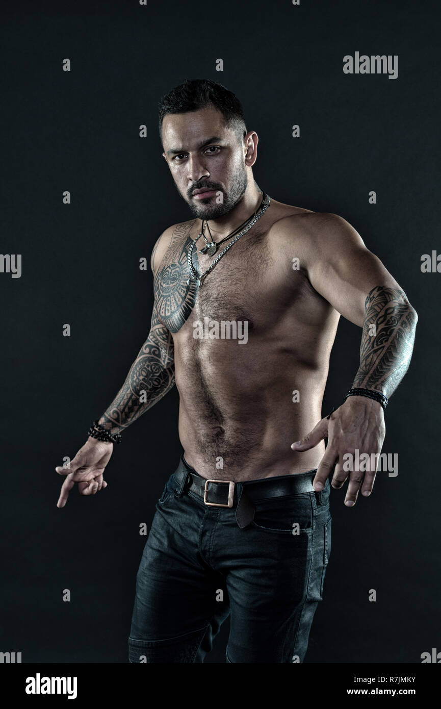 Brutal strict macho with tattoos. Masculinity and brutality. Tattoo culture  concept. Tattoo brutal attribute. Bearded man show tattooed torso. Man  brutal unshaven hispanic appearance tattooed arms Stock Photo - Alamy