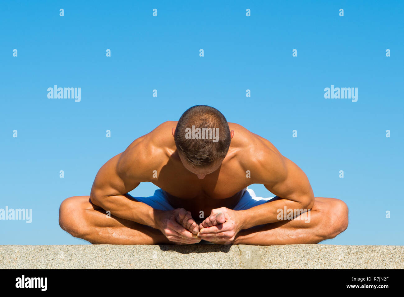 Flexible body is his merit. Mental and physical health. Muscular man