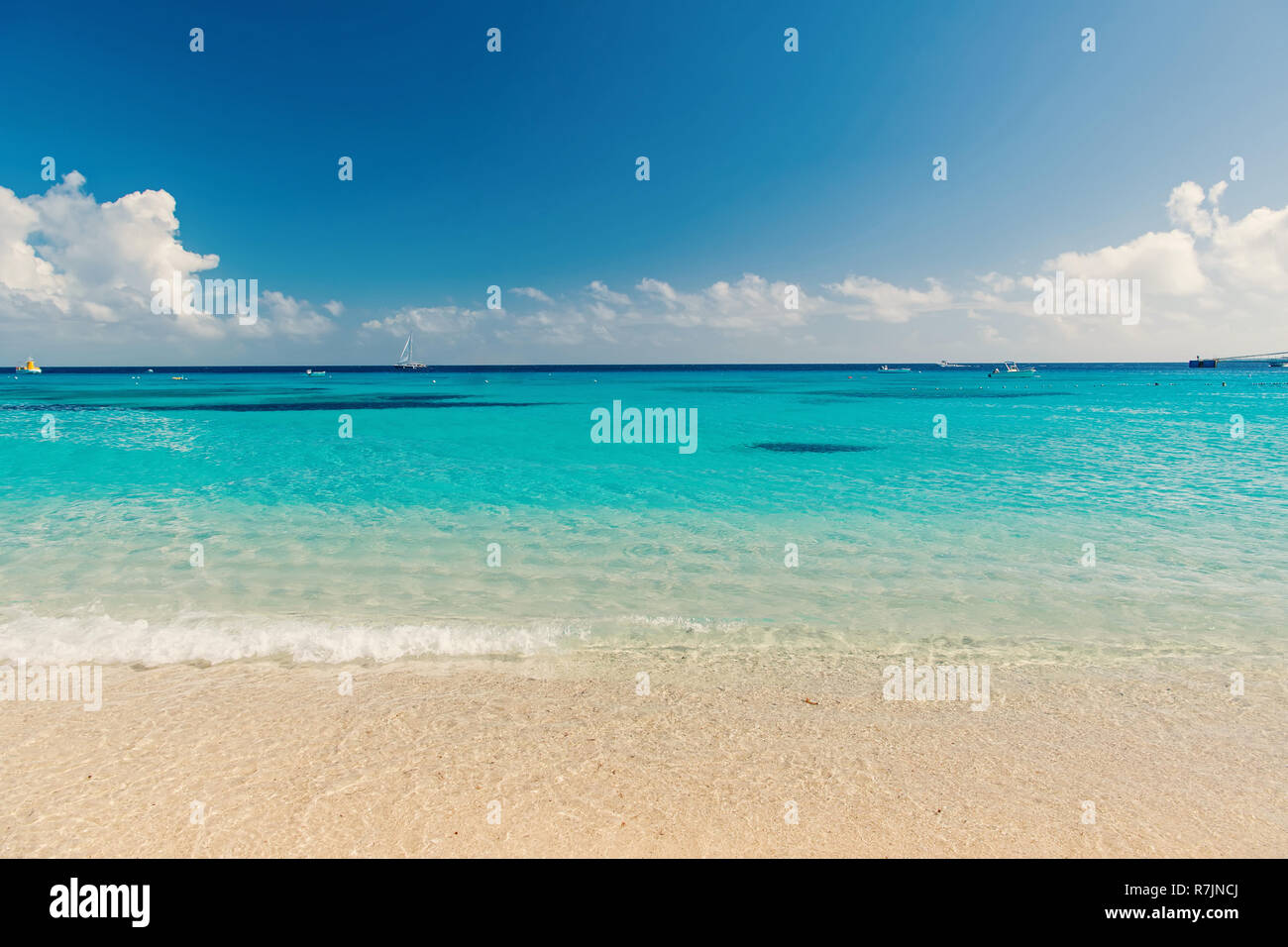 sea. Beautiful white clouds on blue sky over calm sea with sunlight ...