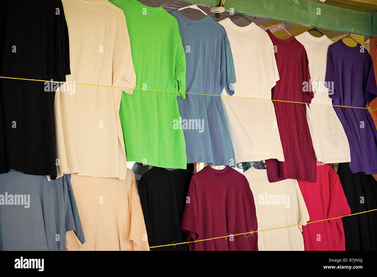 Tshirts hang in local shop or market in castries, st.lucia. Colorful  clothes on sale. Sale, shopping and purchase. Black Friday and cyber monday  concept Stock Photo - Alamy