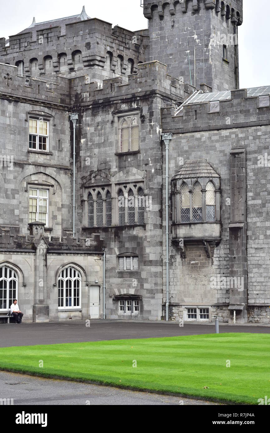 Vertical view of one of towers of Kilkenny Castle from lawn of internal courtyard. Stock Photo