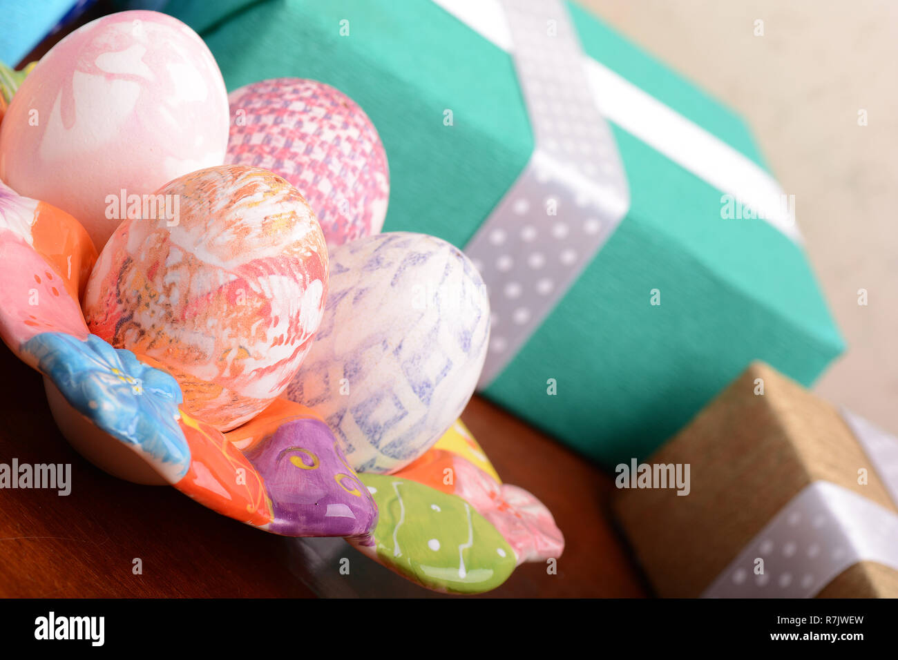 Handcrafted easter eggs close up, gift boxes , ribbons and decoration Stock Photo