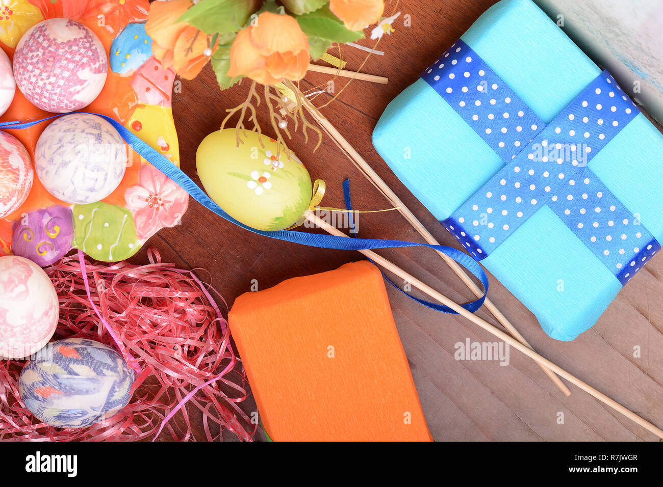 Handcrafted easter eggs close up, gift boxes , ribbons and decoration Stock Photo