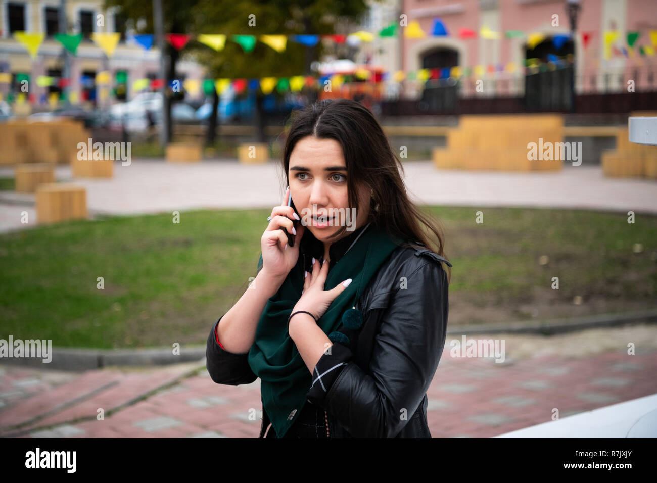 Portrait of a surprised young woman talking on mobile phone. Human face expression, emotion, bad news reaction Stock Photo