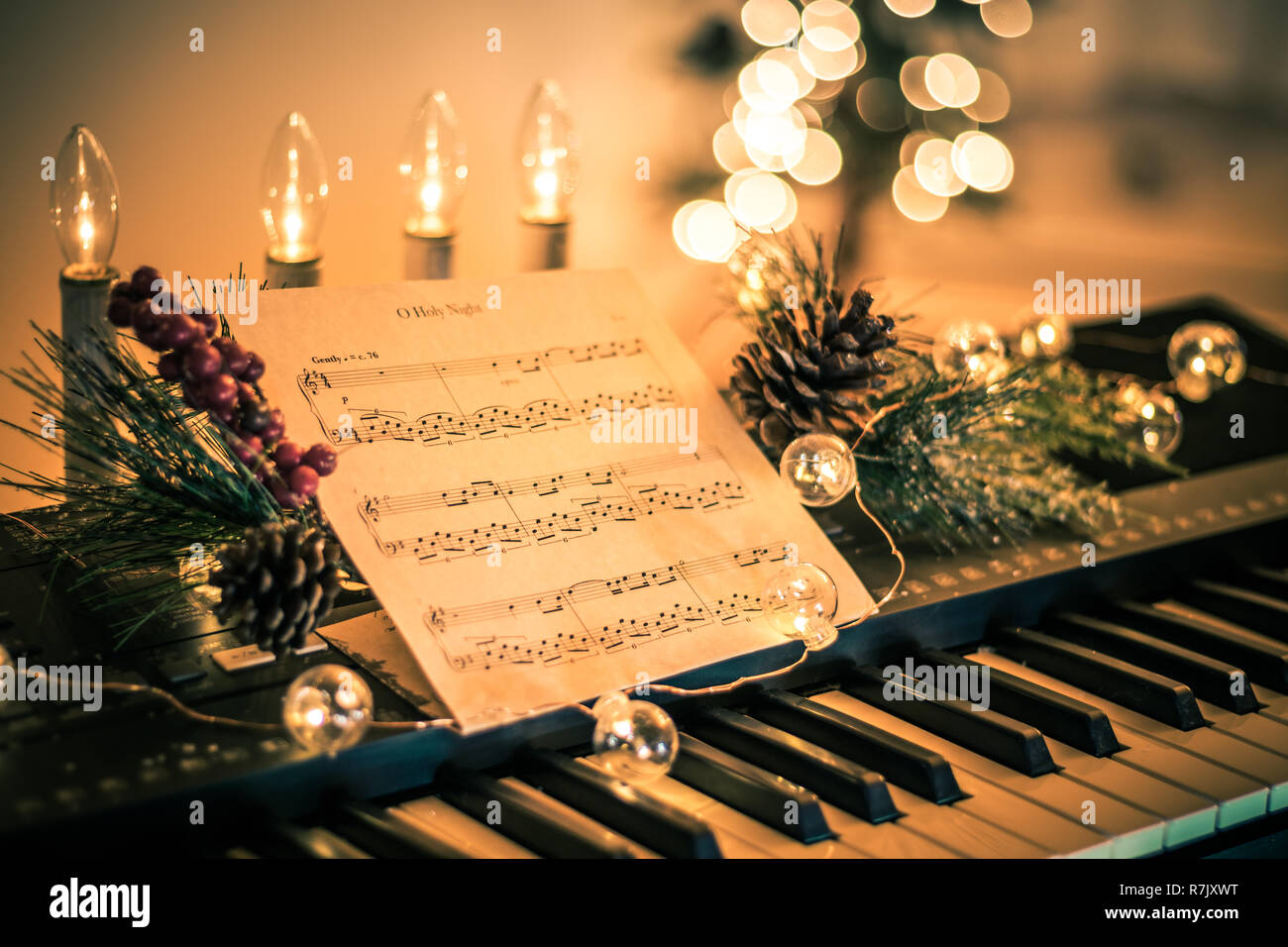 Keyboard with instrumental sheet music and soft lights for ...