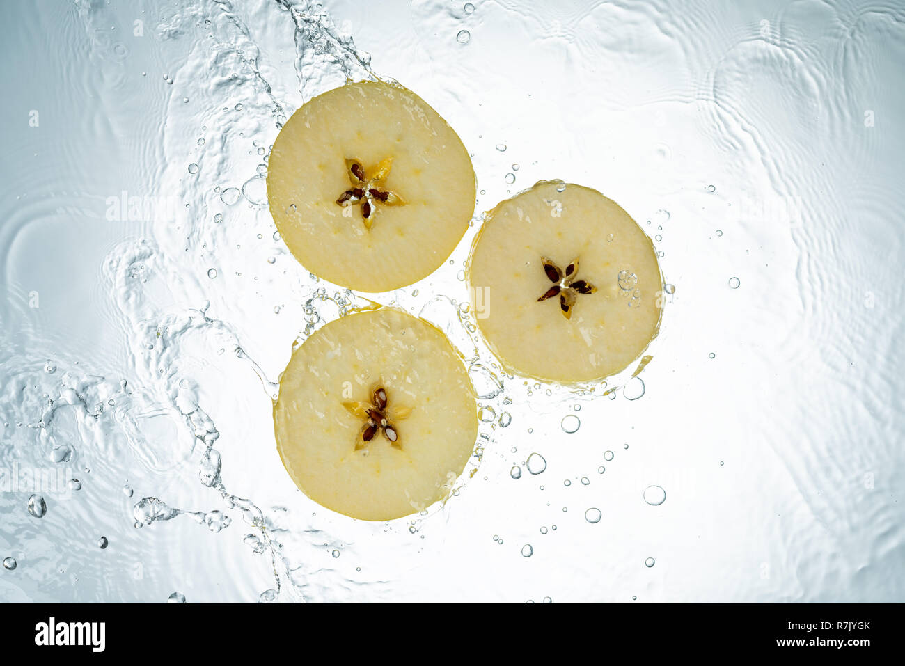 Apples Water Splash on White Background Stock Photo
