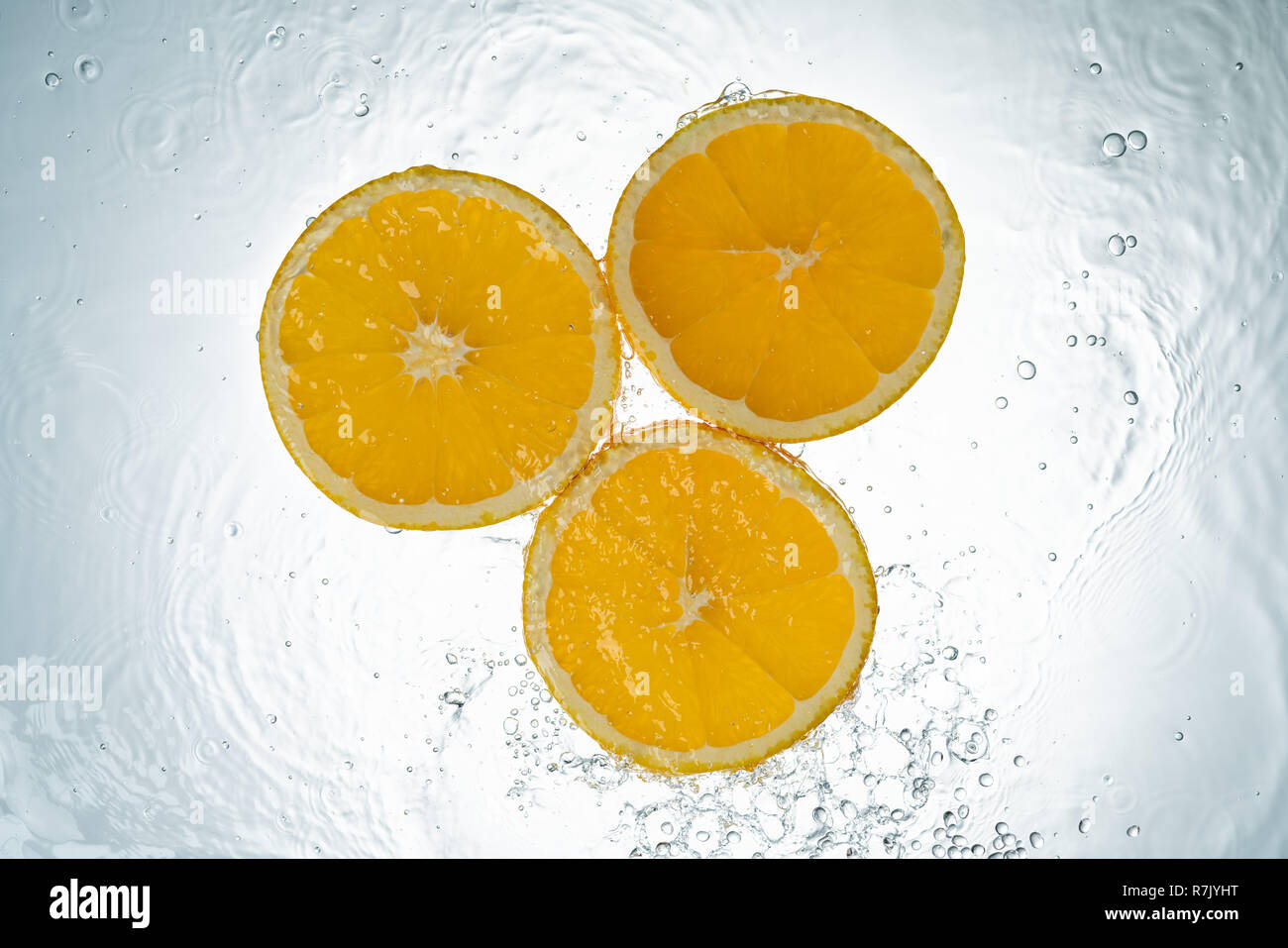 Oranges Water Splash on white background Stock Photo - Alamy