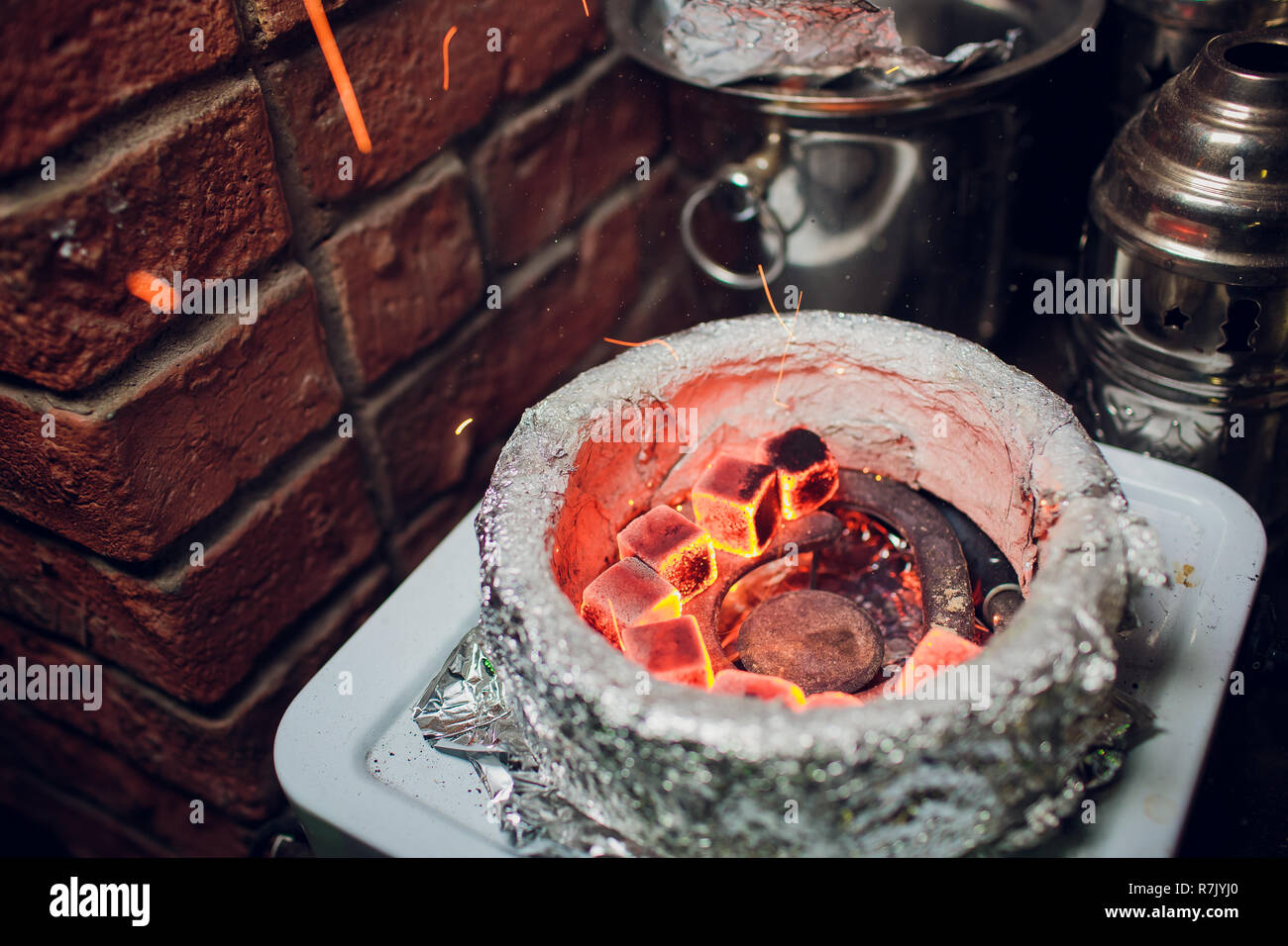hookah. preparation of coal for hookah. warmup Stock Photo Alamy