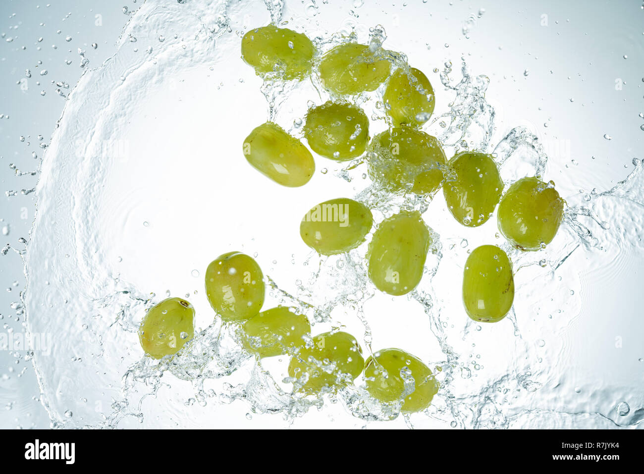 Green Grapes Water Splash on white background Stock Photo