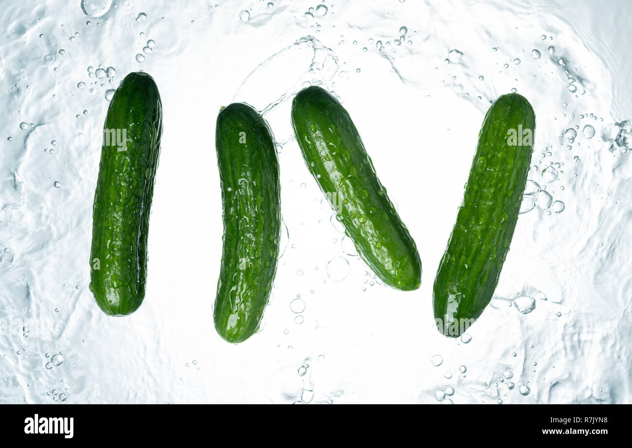 Cucumbers Water Splash on white background Stock Photo Alamy