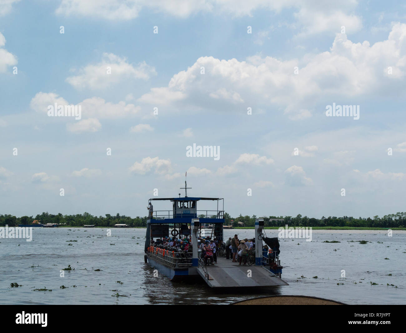 Passenger Ferry arriving at Cai Be having crossed the Mekong River in ...