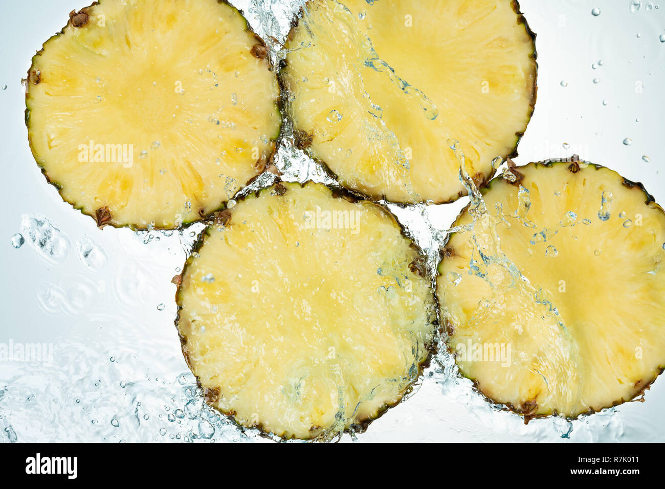 Pineapple Water Splash on White Baclground Stock Photo