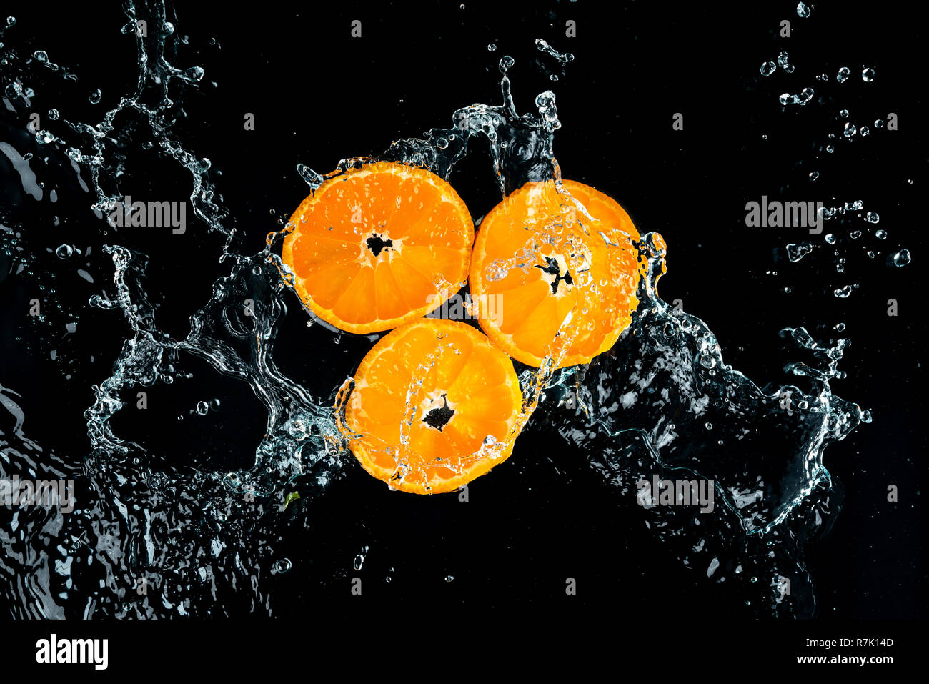 Oranges Water Splash on black background Stock Photo Alamy