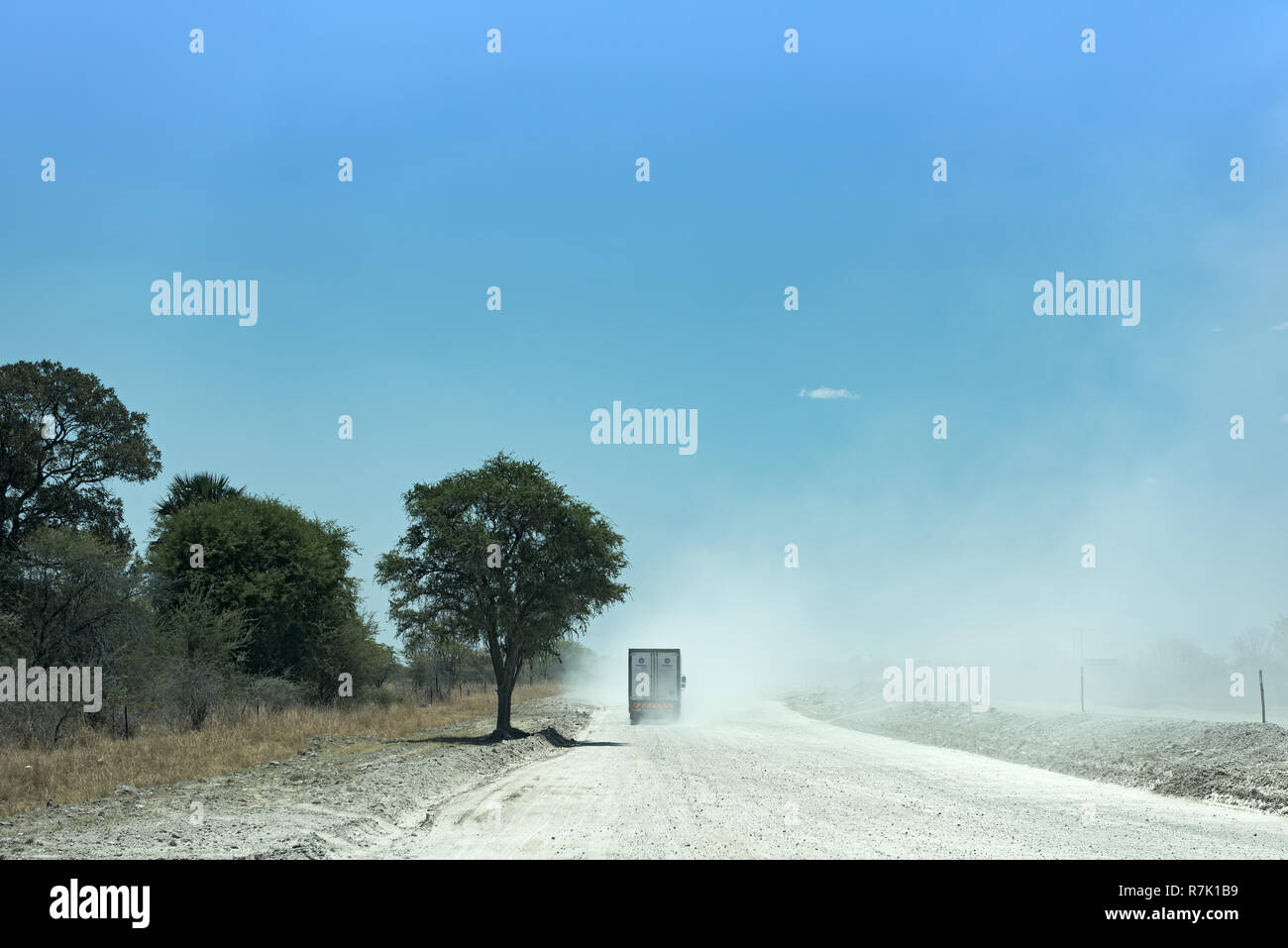 Truck on a dirt gravel road in Botswana Stock Photo
