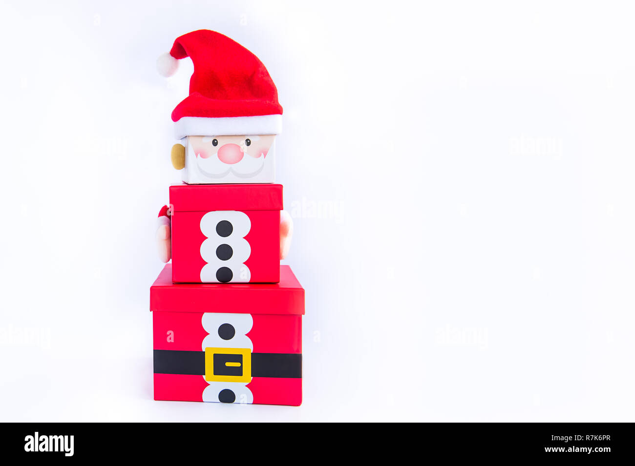 Christmas gift boxes tower in the shape of a Santa Clause on white background isolated. Xmas. family holiday concept. Merry Christmas and Happy Holida Stock Photo