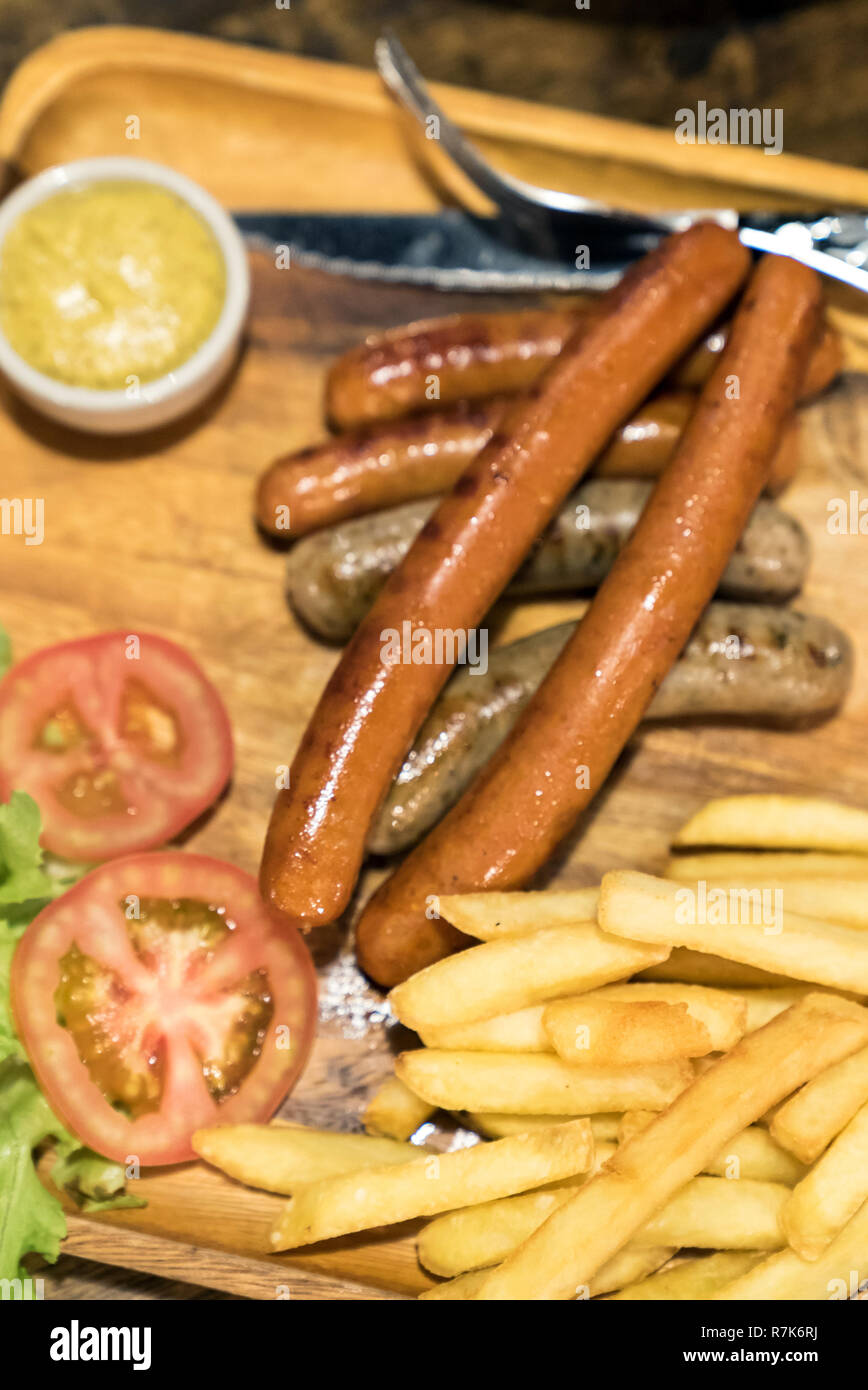 grilled German Sausages with fries Stock Photo Alamy