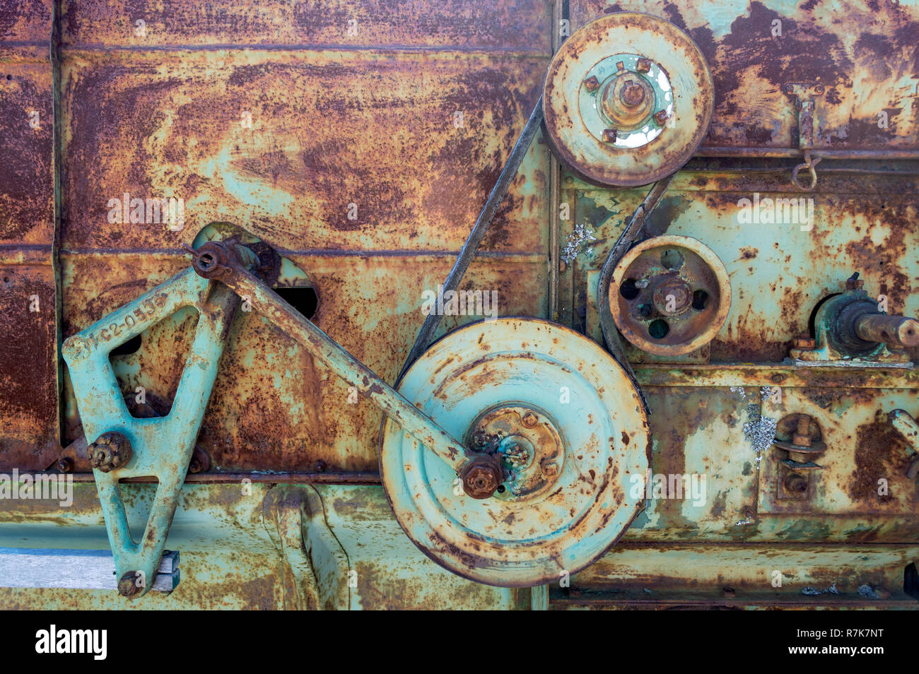 Rusty machine gears, pulleys, and belt Stock Photo