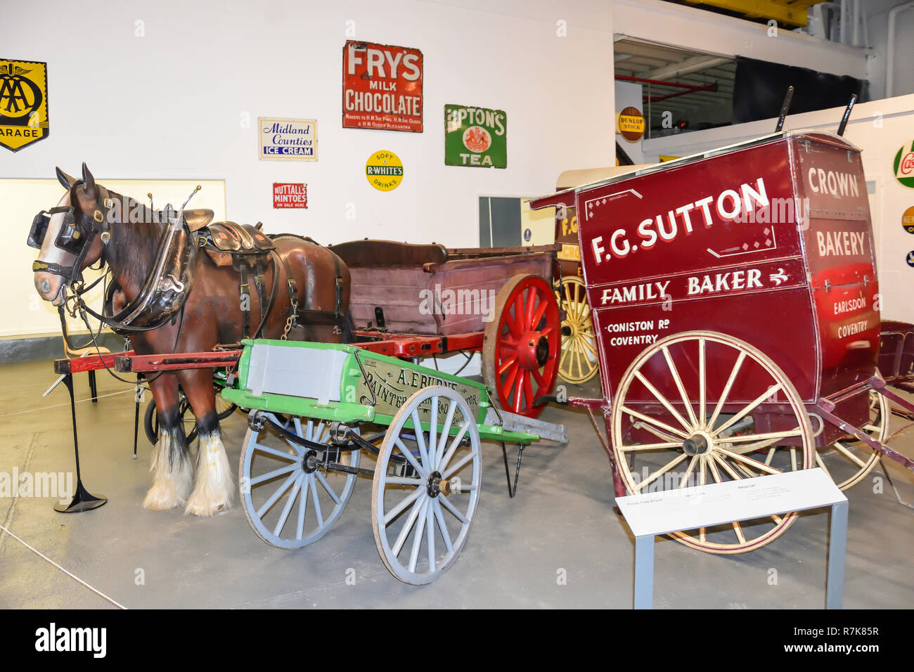 Horse and cart display in Coventry Transport Museum, Millennium Place, Coventry, West Midlands, England, United Kingdom Stock Photo