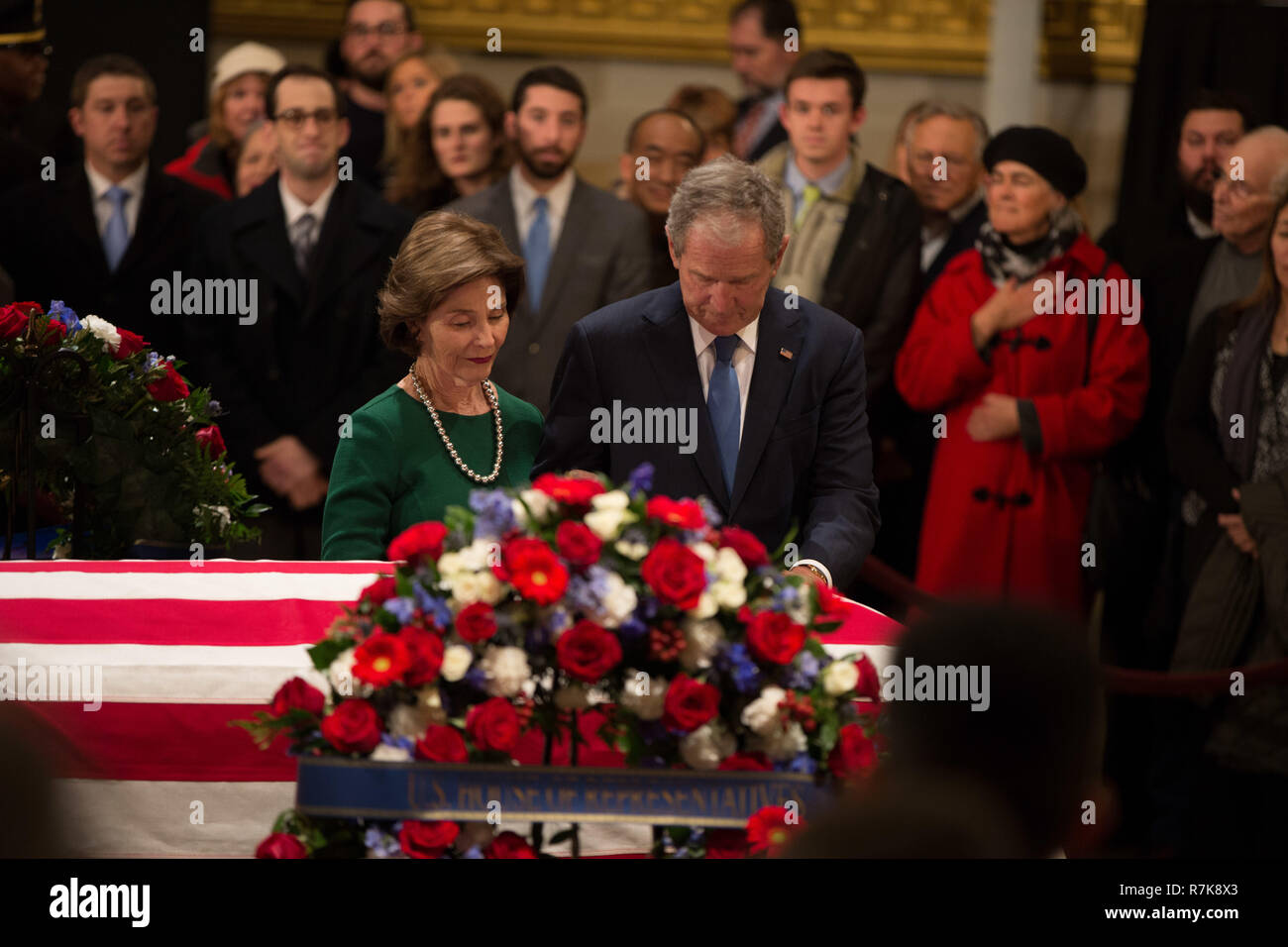 Former President George W. Bush and his wife Laura pay respect to his fathers flag draped casket, former President George H. W. Bush as as it lies in state at the Capitol Rotunda December 4, 2018 in Washington, DC. Bush, the 41st President, died in his Houston home at age 94. Stock Photo