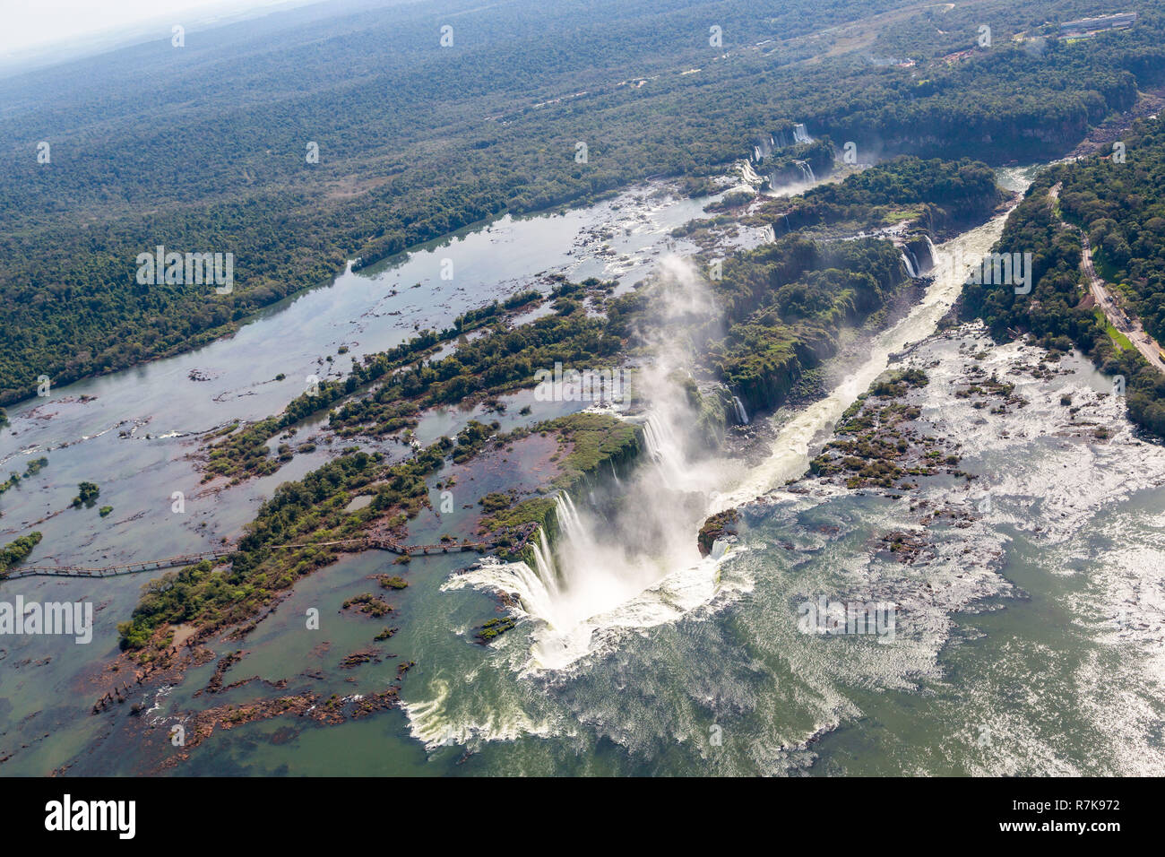 Aerial bird's-eye view panorama of Iguazu Falls from above, from a helicopter. Border of Brazil and Argentina. Iguassu, Iguacu waterfalls. Stock Photo