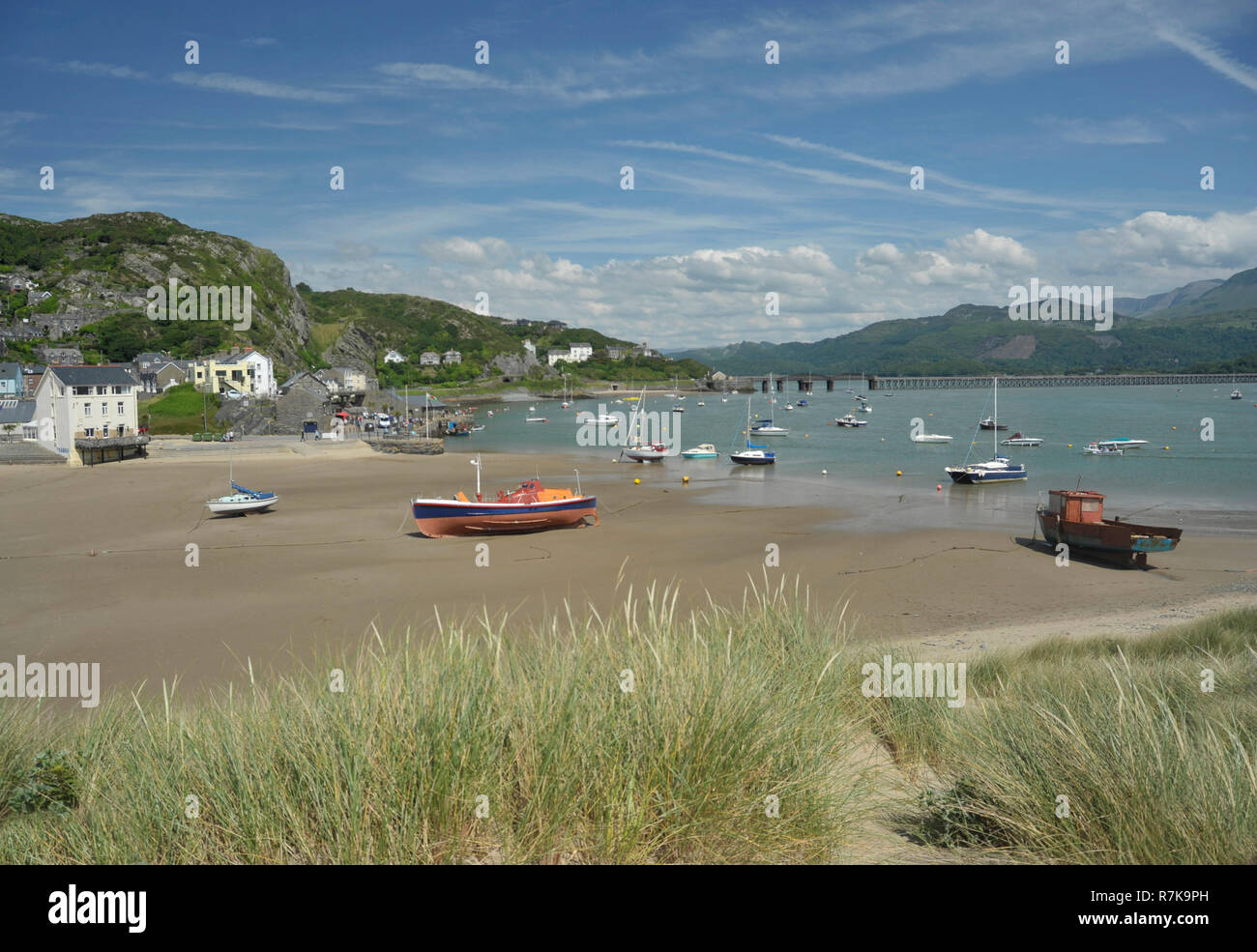 Barmouth town and harbour with landmark railway viaduct over the estuary of the river Mawddach and Cardigan Bay, the marina and quay in Gwynedd, North Stock Photo