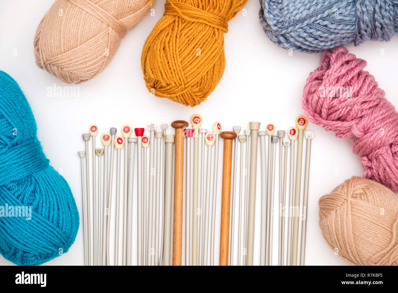Collection of knitting needles and wool on a white background Stock ...
