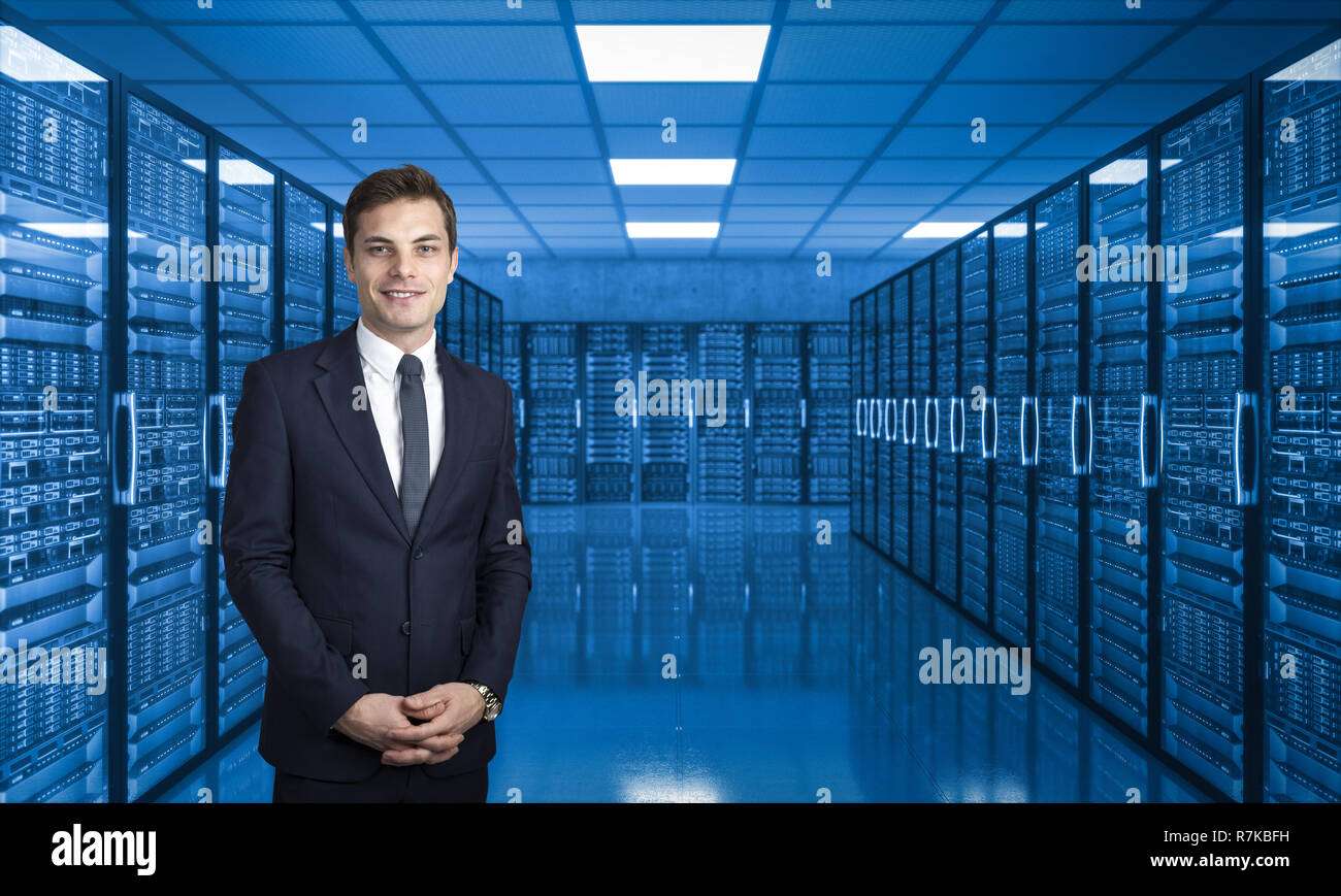 smiling businessman in server data center Stock Photo