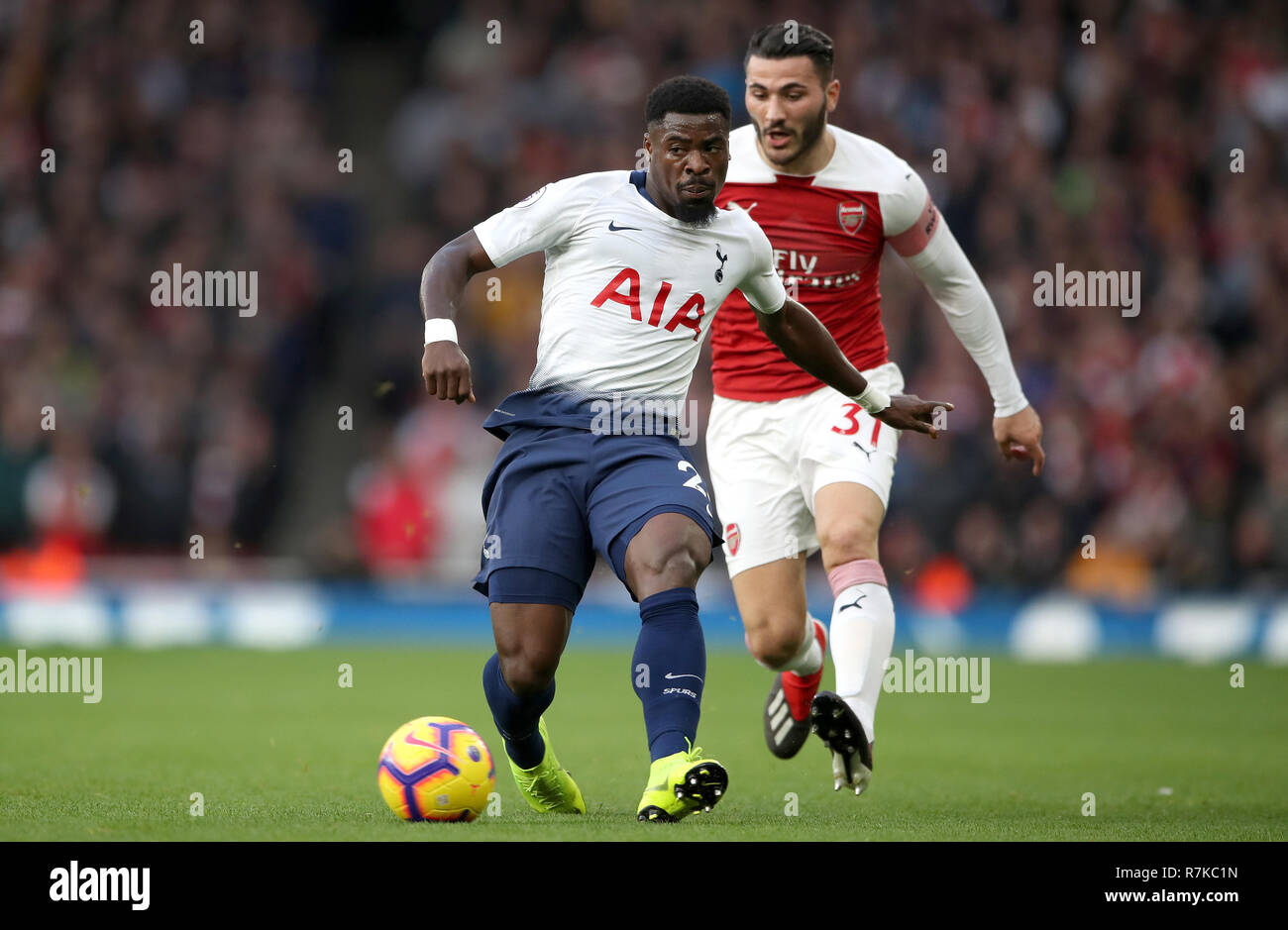 Arsenal's Sead Kolasinac (left) and Tottenham Hotspur's Serge Aurier battle for the ball Stock Photo