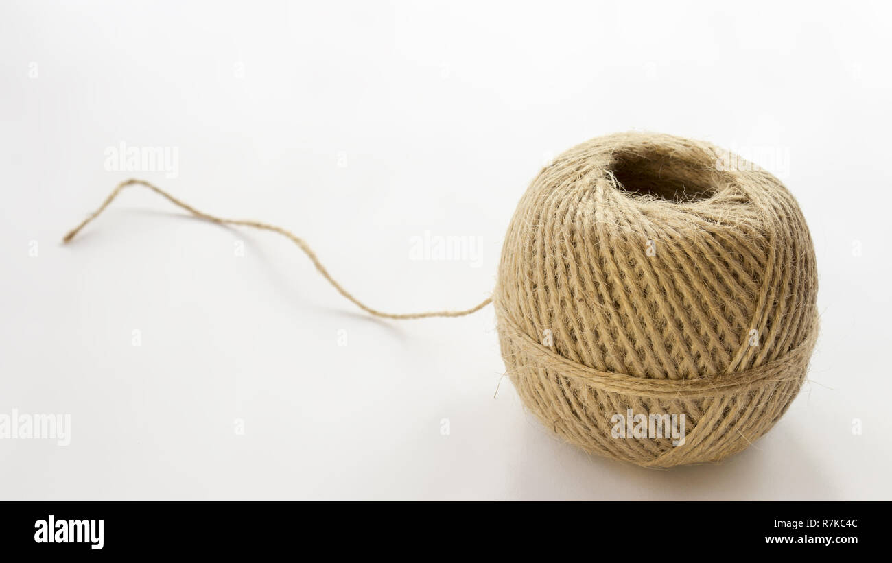 On a white background is a ball of rope. On the white background is free space for text. Stock Photo