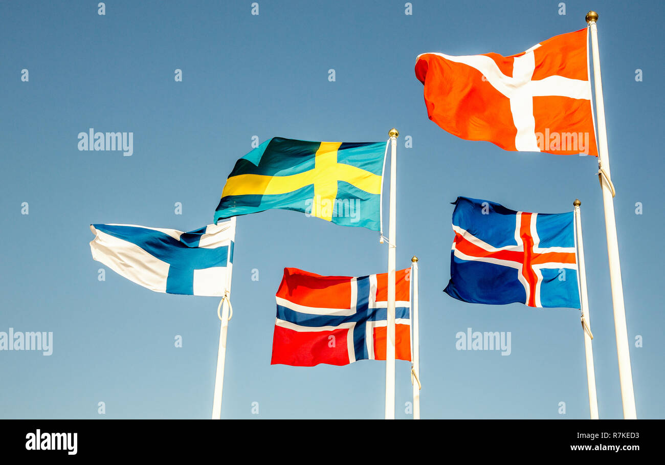 Danish, Swedish, Icelandic, Finnish and Norwegian scandinavian flags waving on the wind in Helsinborg, Sweden Stock Photo