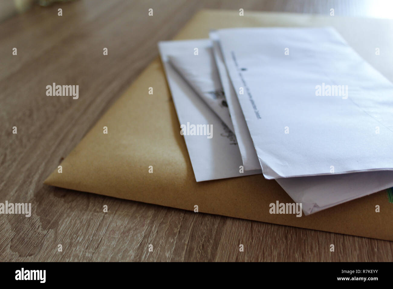 Stack of Letters lying on Table Stock Photo