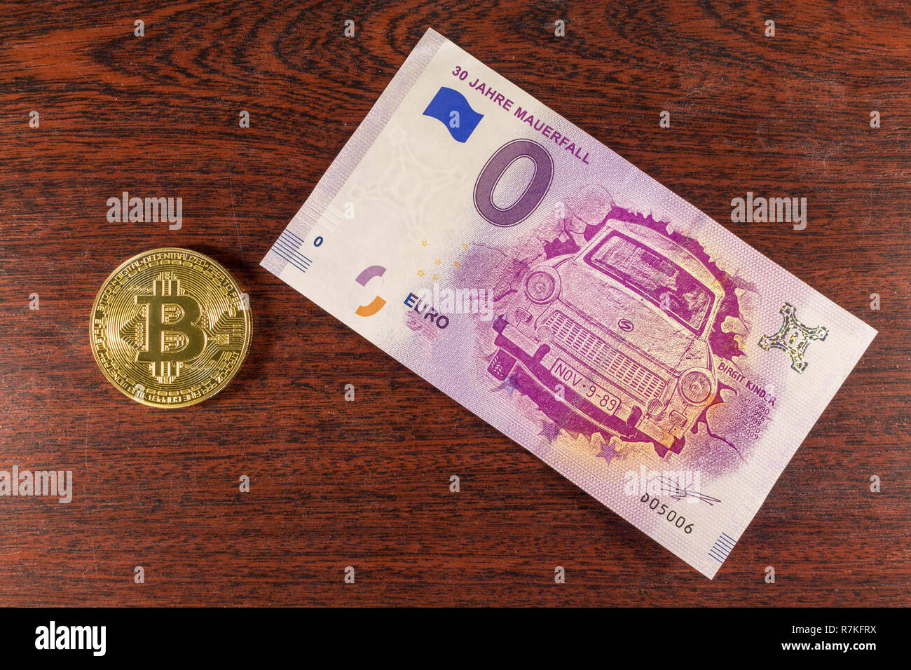 Bitcoin coin on the 0 euro bill lies Stock Photo - Alamy